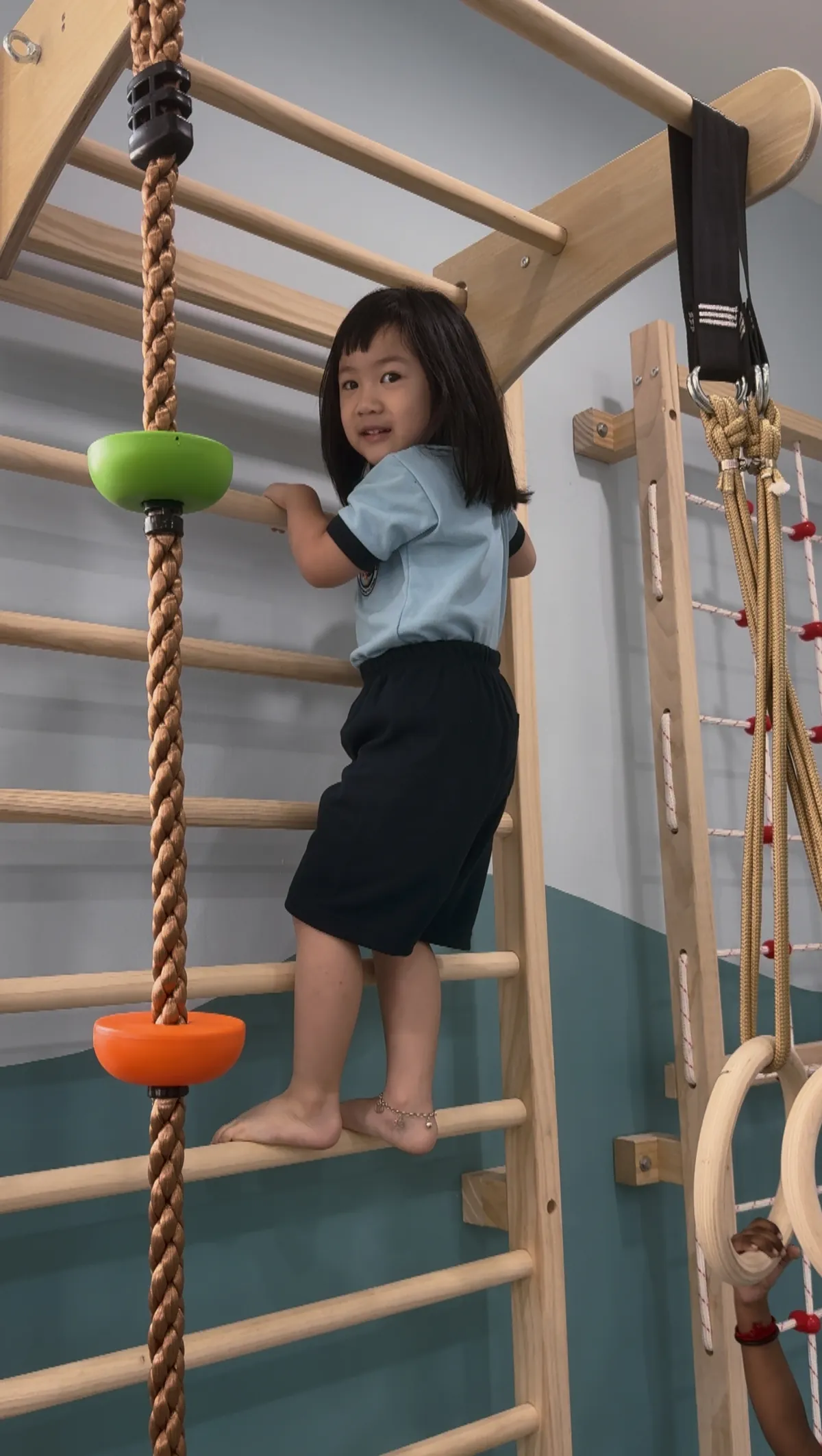 Child developing balance through indoor play
