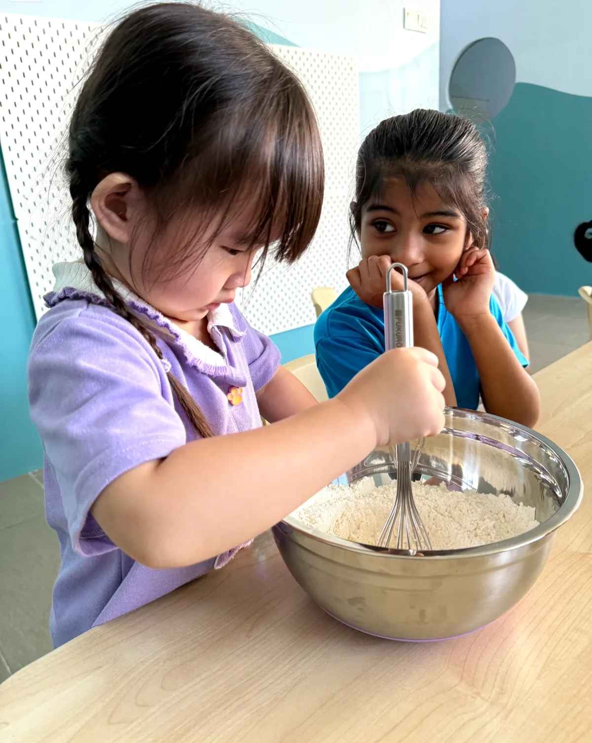 Children taking part in a practical food preparation activity